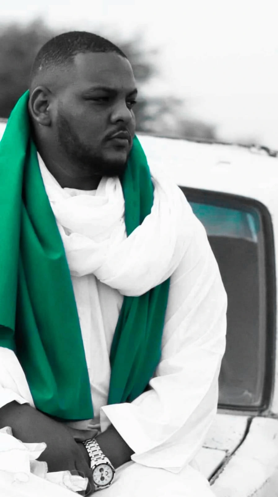Ali Naseraldeen in white with a green scarf